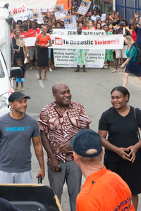 Justice Minister Ronald Warsal took his place at the head of a march to end violence against women.
