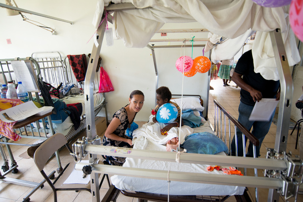 Miss Vanuatu Valerie Martinez visits the children's ward at Vila Central Hospital.

