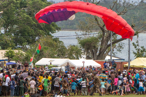 A French Armed Forces sky diver falls short and lands in a crowd of spectators at celebrations marking Vanuatu's 35th anniversary of independence.

