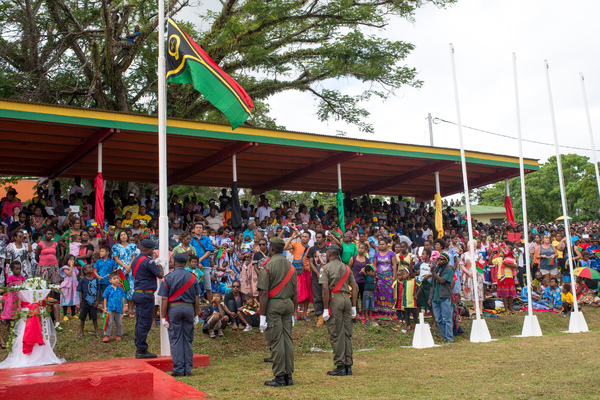 The colour guard raises Vanuatu's flag during celebrations marking the 35th anniversary of independence in Port Vila. The flag was raised, then lowered to half-staff to mark the passing of Edward Natapei just two days earlier.
