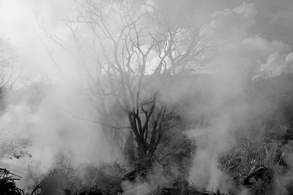 Smoke from the burning of massive amounts of refuse in the aftermath of cyclone Pam.
