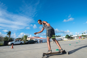 The Vanuatu National Surfing team does a little dry-land training. Boucherie Furet very kindly allowed its parking lot to be repurposed for a day as a dry-land training ground. The team members used specially crafted skateboards designed to mimic a surfboard's feel as the trainees run the slalom course. The team, aged between 10 and 35 years old, will compete in the Melanesian Cup next month in Noumea.
