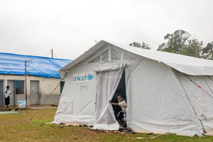 Students from Vila North school in Port Vila work inside the tent that has been their classroom since cyclone Pam destroyed part of the school. UNICEF's extensive support has made it possible for Vila North to continue providing an education for hundreds of children.
