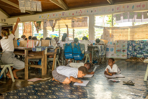 Students from Vila North school in Port Vila work using materials provided by UNICEF, whose extensive support has made it possible for Vila North to continue providing an education for hundreds of children.
