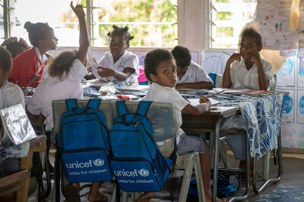 Students from Vila North school in Port Vila work using materials provided by UNICEF, whose extensive support has made it possible for Vila North to continue providing an education for hundreds of children.
