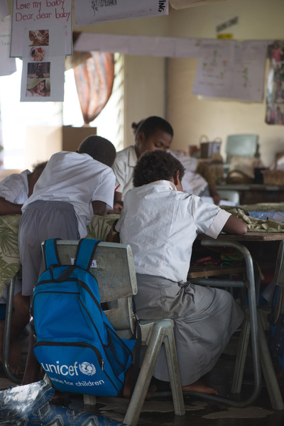Students from Vila North school in Port Vila work using materials provided by UNICEF, whose extensive support has made it possible for Vila North to continue providing an education for hundreds of children.

