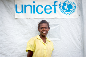 Ellen, a 13 year old student from St Joseph school near Port Vila stands outside the tent that has been her classroom since cyclone Pam destroyed part of the school. If not for the shelter supplied by UNICEF, students would have been sent home on a rotating basis.
