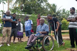 Shots from a memorial tree planting ceremony.
